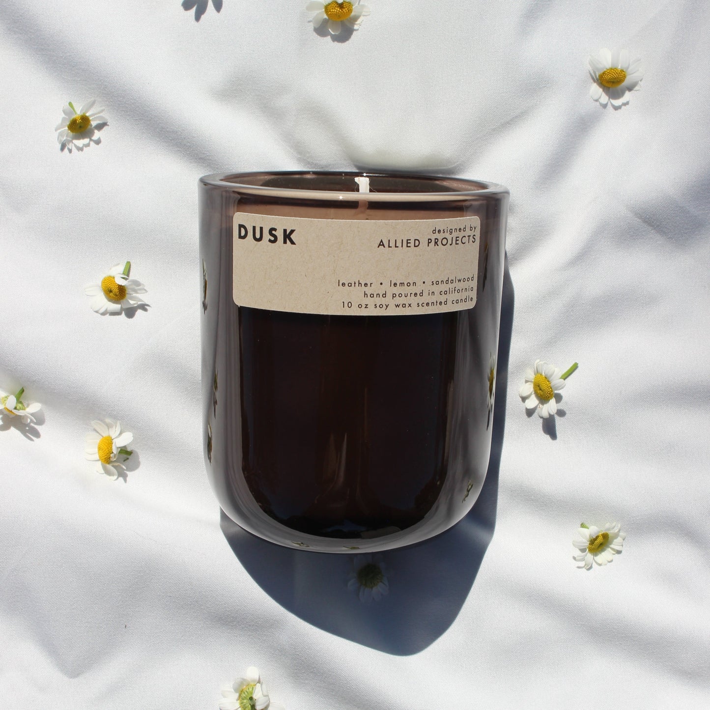 A handcrafted, eco-friendly candle designed for those who love deep, moody scents. This luxury, hand-poured candle features a sophisticated blend of warm sandalwood, rich leather, and a refreshing hint of lemon, creating a bold yet smooth aroma perfect for evening relaxation. Made with natural, sustainable wax and a clean-burning, non-toxic formula, Dusk enhances any space with its refined and grounding fragrance.