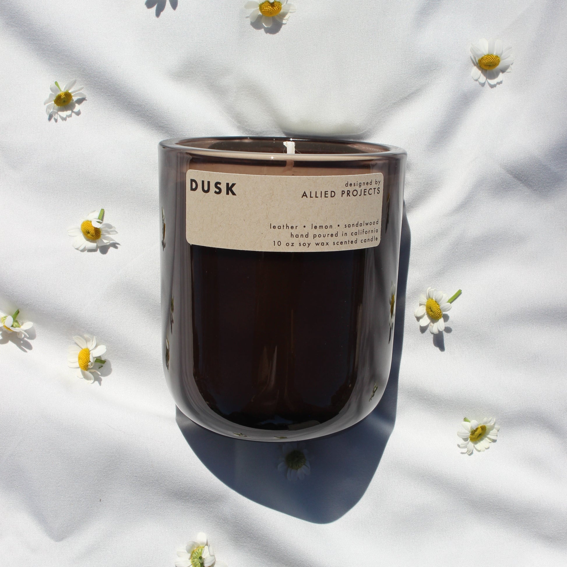 A handcrafted, eco-friendly candle designed for those who love deep, moody scents. This luxury, hand-poured candle features a sophisticated blend of warm sandalwood, rich leather, and a refreshing hint of lemon, creating a bold yet smooth aroma perfect for evening relaxation. Made with natural, sustainable wax and a clean-burning, non-toxic formula, Dusk enhances any space with its refined and grounding fragrance.