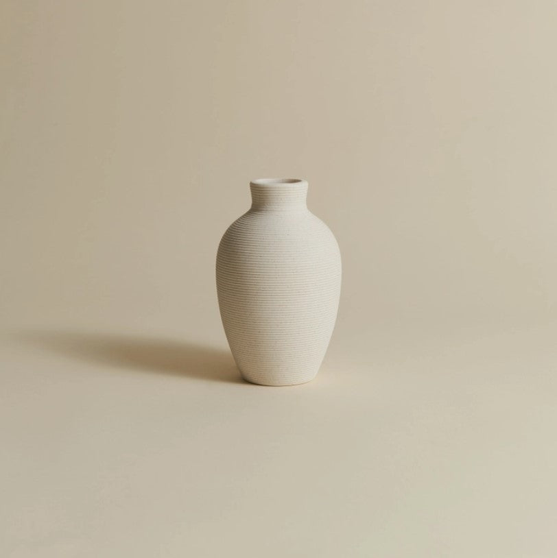 Handmade porcelain Curvy Vase by Allied Goods, featuring a unique and elegant design. Allied Goods Curvy Vase, crafted from porcelain with a fluid, sculptural shape for modern decor. Elegant porcelain Curvy Vase, ideal for floral arrangements or as a statement piece in any room. Sculptural Curvy Vase in handmade porcelain, perfect for adding a contemporary touch to your space.