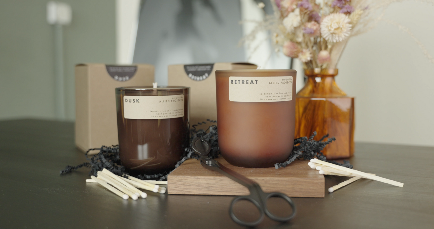 Retreat luxury candle by Allied Goods, designed for a rejuvenating, fresh home fragrance. Eco-friendly Retreat candle with light fragrance, ideal for relaxation and self-care. Luxury candle with clean-burning wax and natural fragrance by Allied Goods. Eco-friendly candle with sustainable ingredients for a refreshing home scent.  Dusk candle with soothing fragrance and minimalist design, perfect for evening relaxation. Allied Goods Dusk candle with calming scent for a peaceful home ambiance.