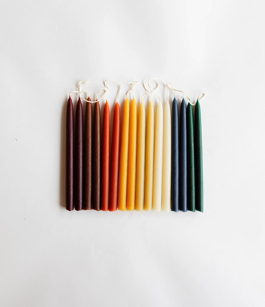Long-lasting, available in many colors, dripless taper candles in neutral tones, ideal for home decor.