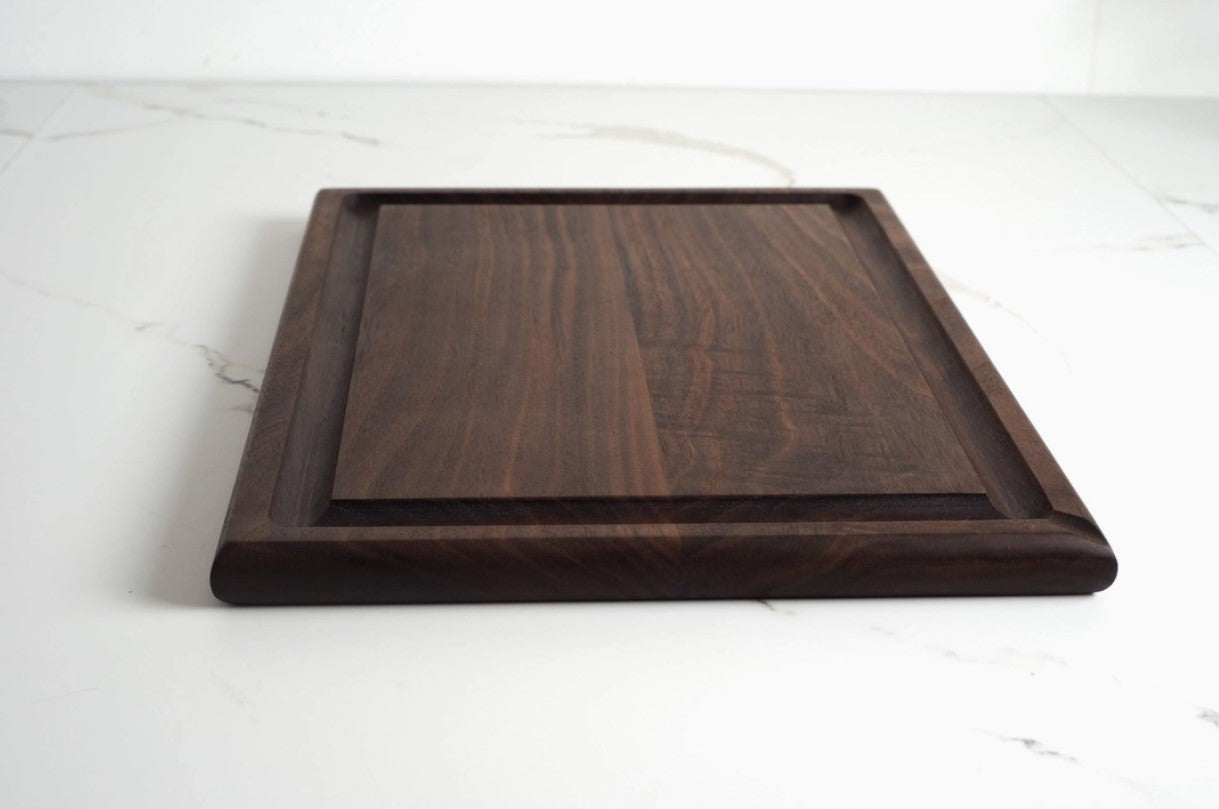 Handcrafted cherry wood and walnut cutting boards by Allied Goods, perfect for kitchen prep or serving. Premium cherry wood and walnut cutting boards, designed for durability and elegant kitchen use. Allied Goods cherry and walnut cutting boards, featuring a beautiful wood grain and sturdy surface. Sustainable cherry wood and walnut cutting boards, ideal for chopping, slicing, and serving in style.